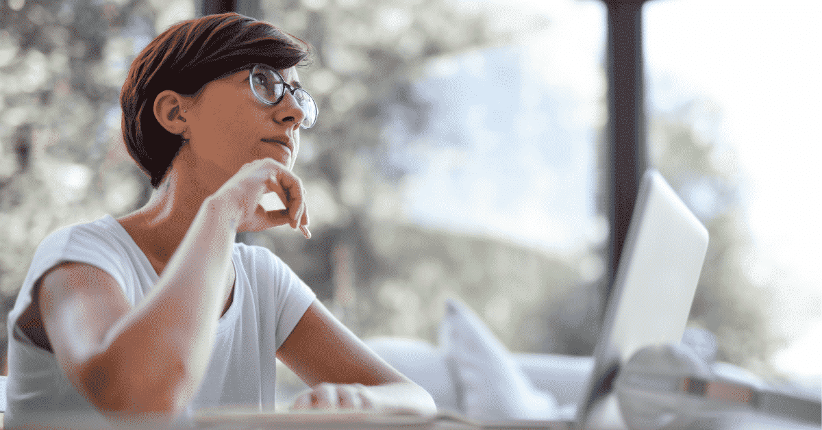 Womam at a laptop searching for a buyer's agent