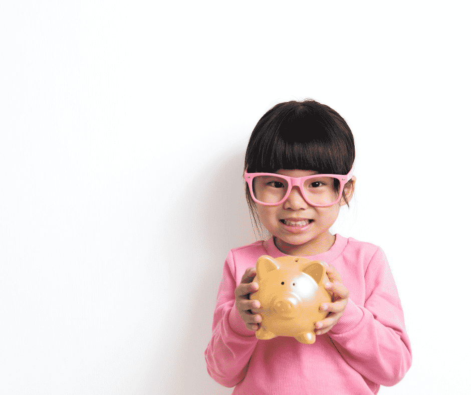 Young girl with piggy bank